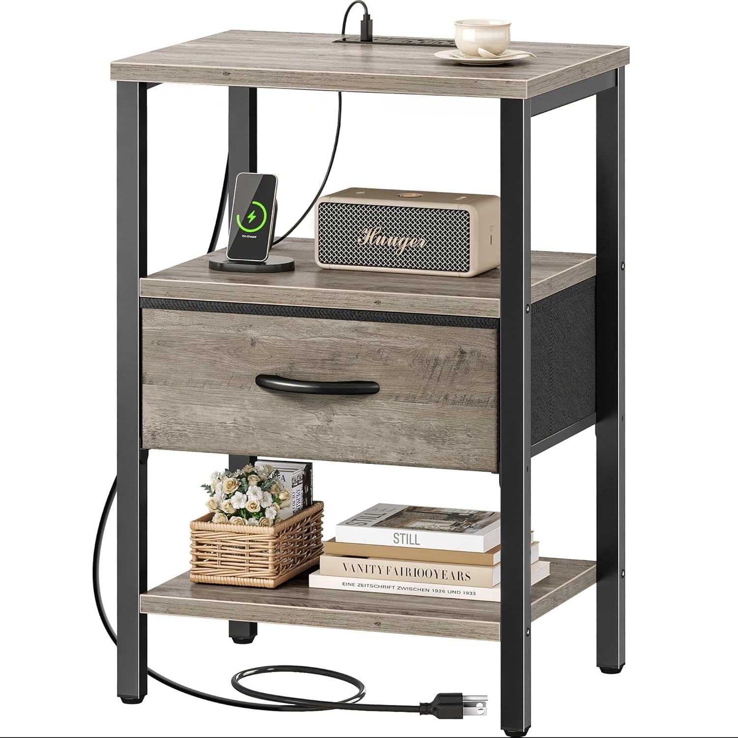 Gray wood-look nightstand with black metal legs, fabric drawer, lower shelf and charging plug coiled at base