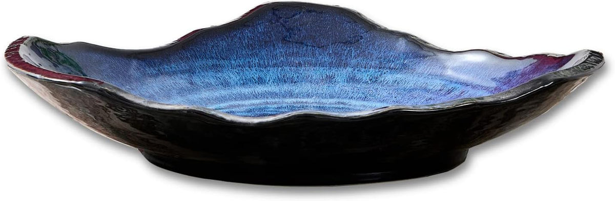 Front profile of the bowl against a white background showing blue-tinted interior and dark exterior