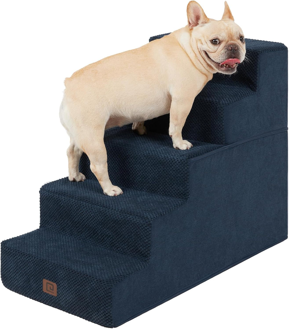 Dark blue four-step pet stairs with textured cover and a small fawn dog facing right on the steps