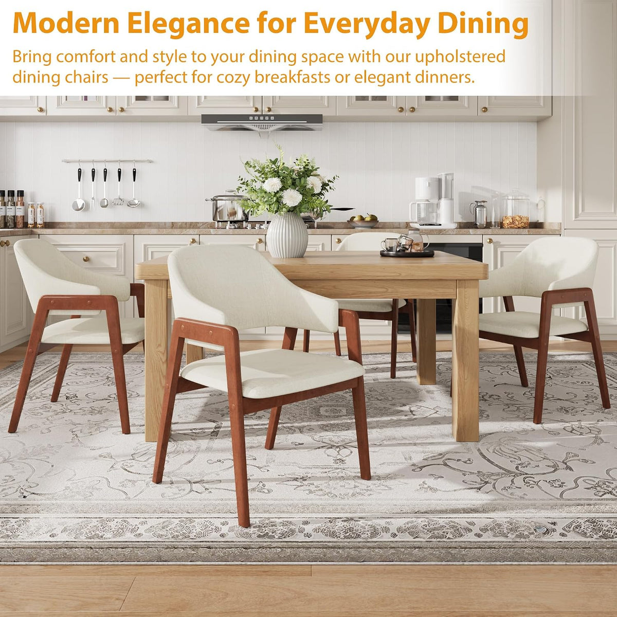 Four beige upholstered chairs around a wooden dining table on a patterned rug in a kitchen-dining setting
