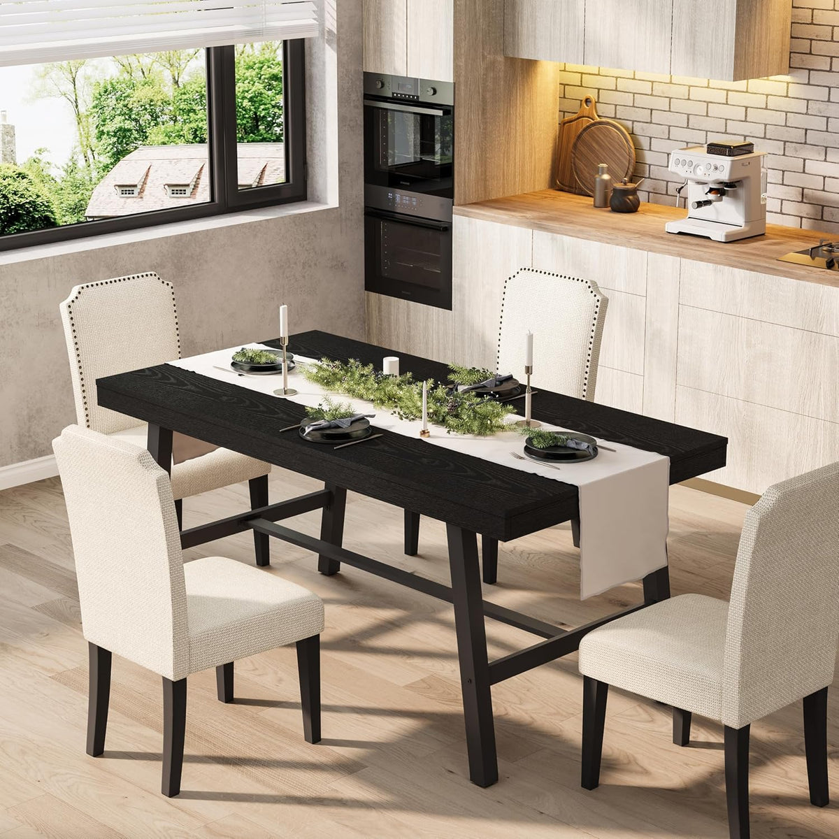 Black wood tabletop on black metal frame set in a kitchen dining scene with cream upholstered chairs.
