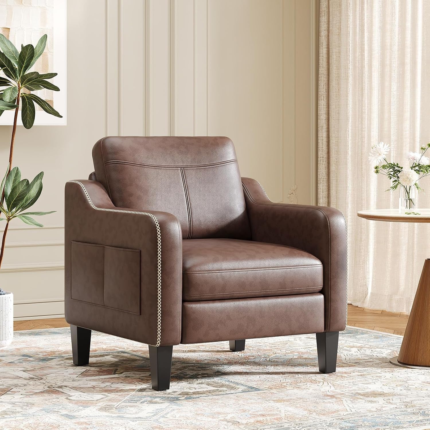 Chocolate brown PU leather armchair with decorative trim and dark wooden legs in staged room
