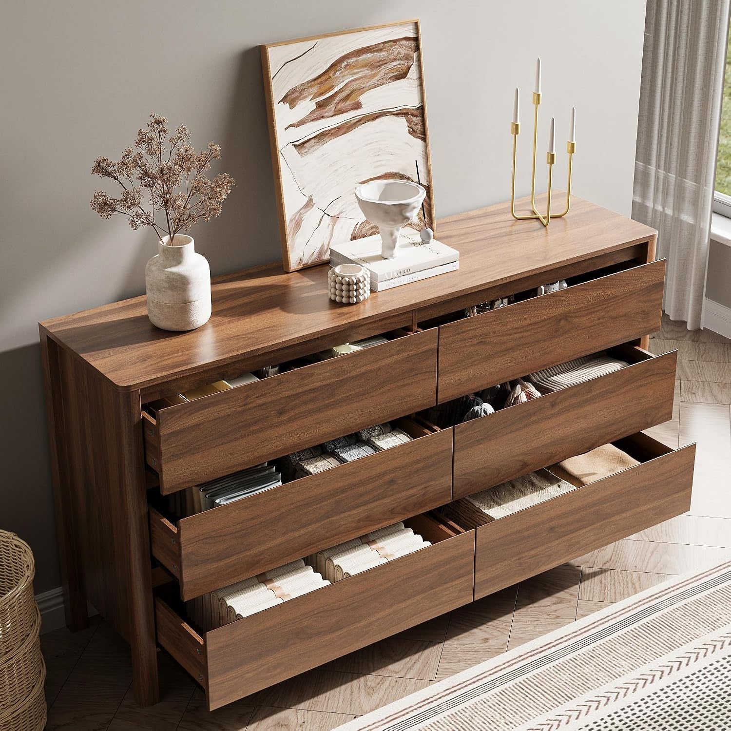 Top-down view with drawers open showing organized folded clothes and smooth sliding drawers