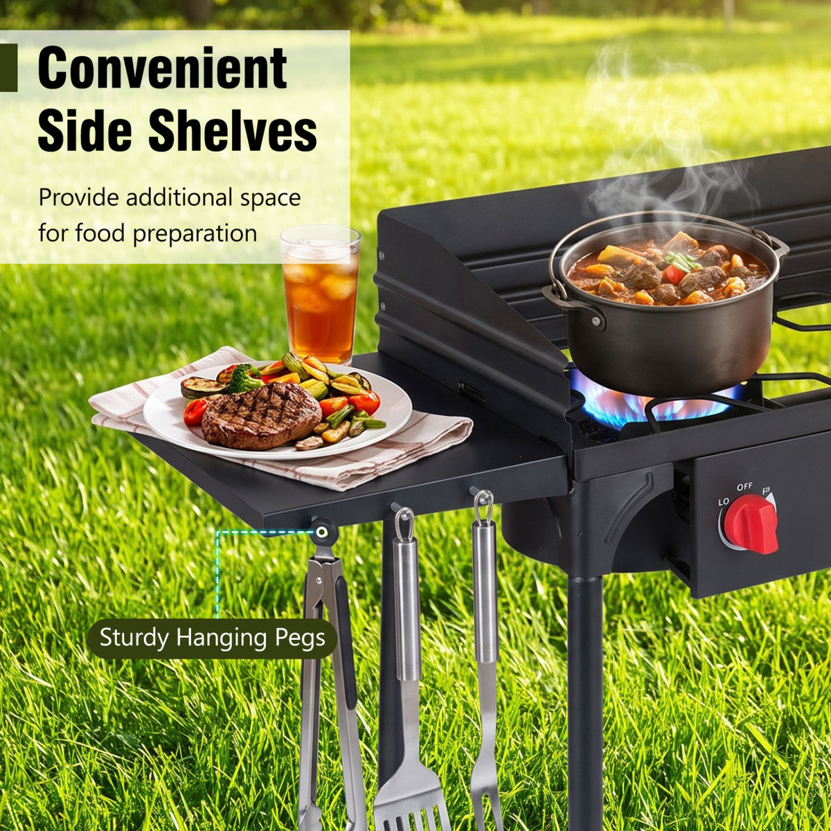 Black cooker with a pot on the burner, food on the side shelf, and cooking utensils hanging beneath it.