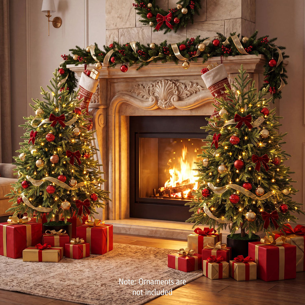 Two decorated, lit Christmas trees flank a fireplace, with stockings, garland and wrapped gifts.