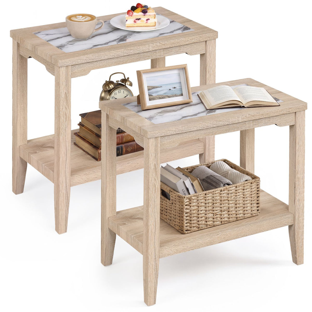 Two light wood end tables with marble-look glass tops and open lower shelves, styled with books, dishes and a woven basket.