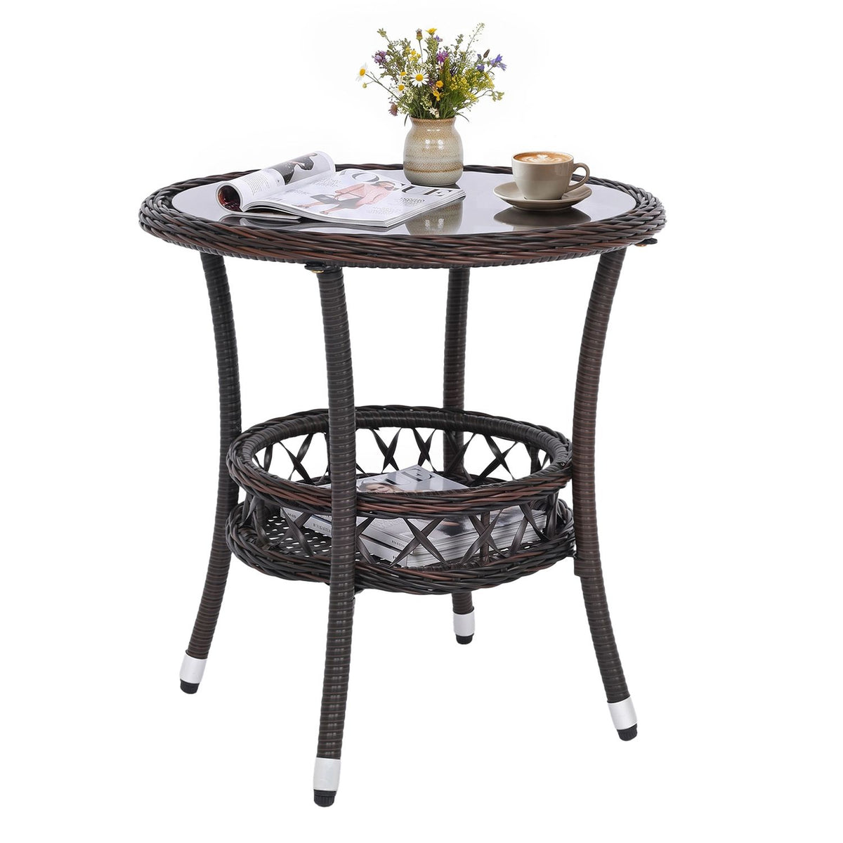 Dark woven bistro table with glass top styled with a cup and flowers