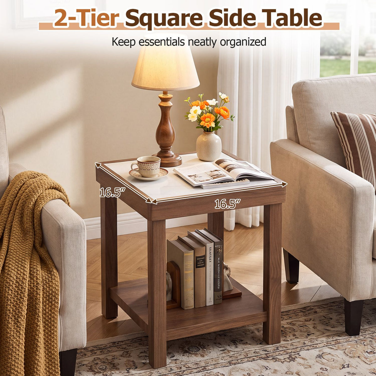 Brown two-tier square side table between two armchairs, with books on its lower shelf.