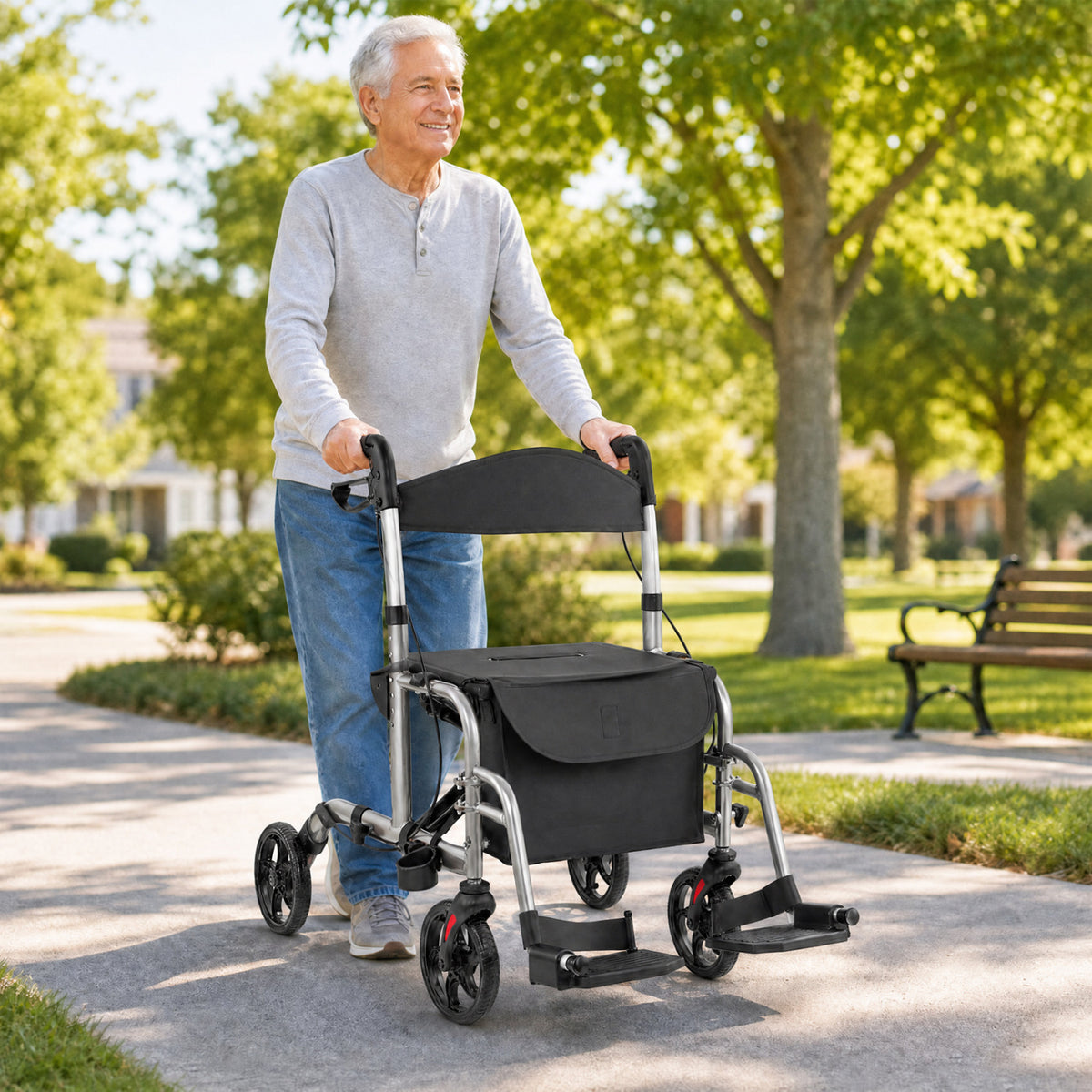 An older man walks outdoors while holding the handles of a black rollator walker.
