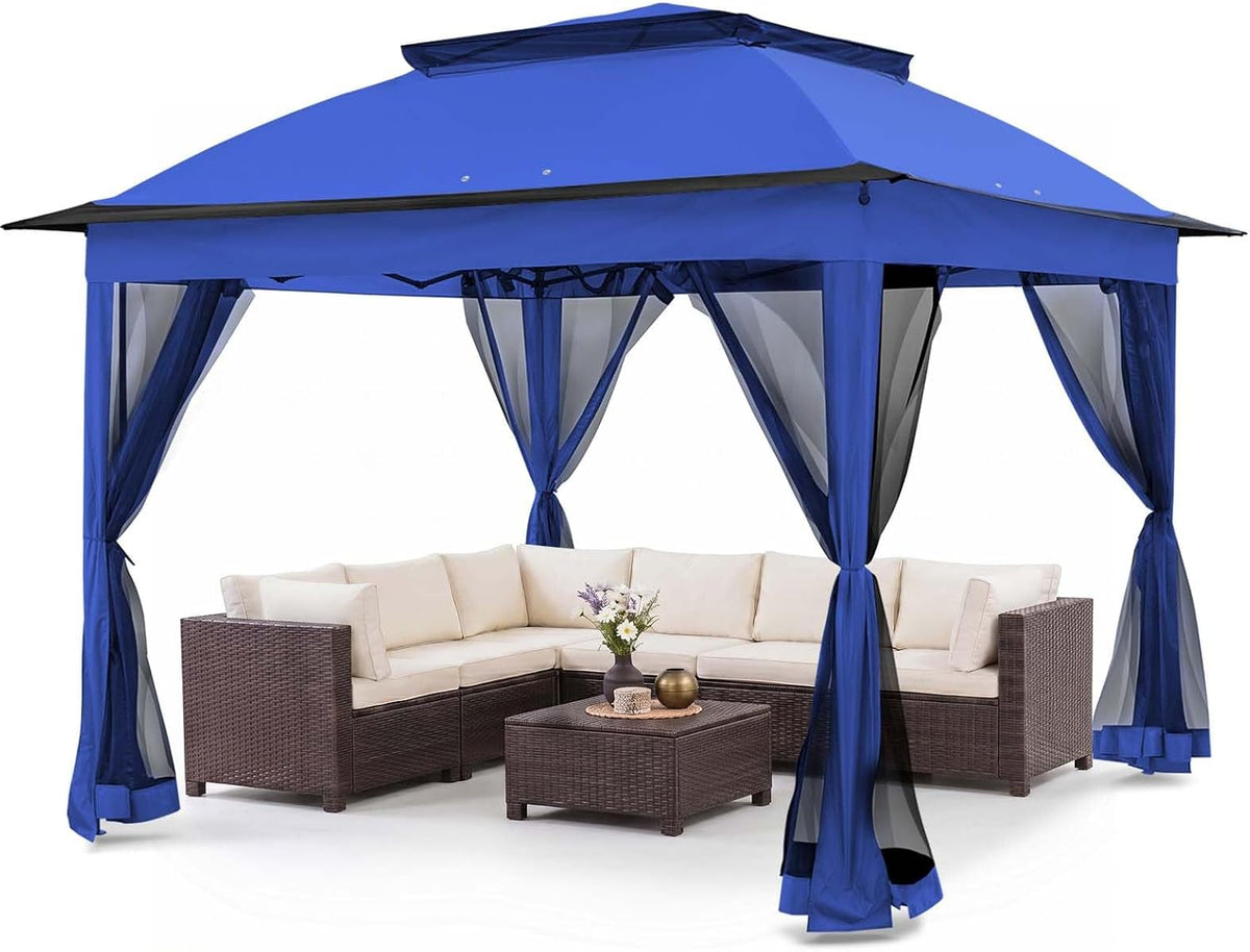 Blue pop-up gazebo with tied-back mesh curtains over patio sectional and coffee table.
