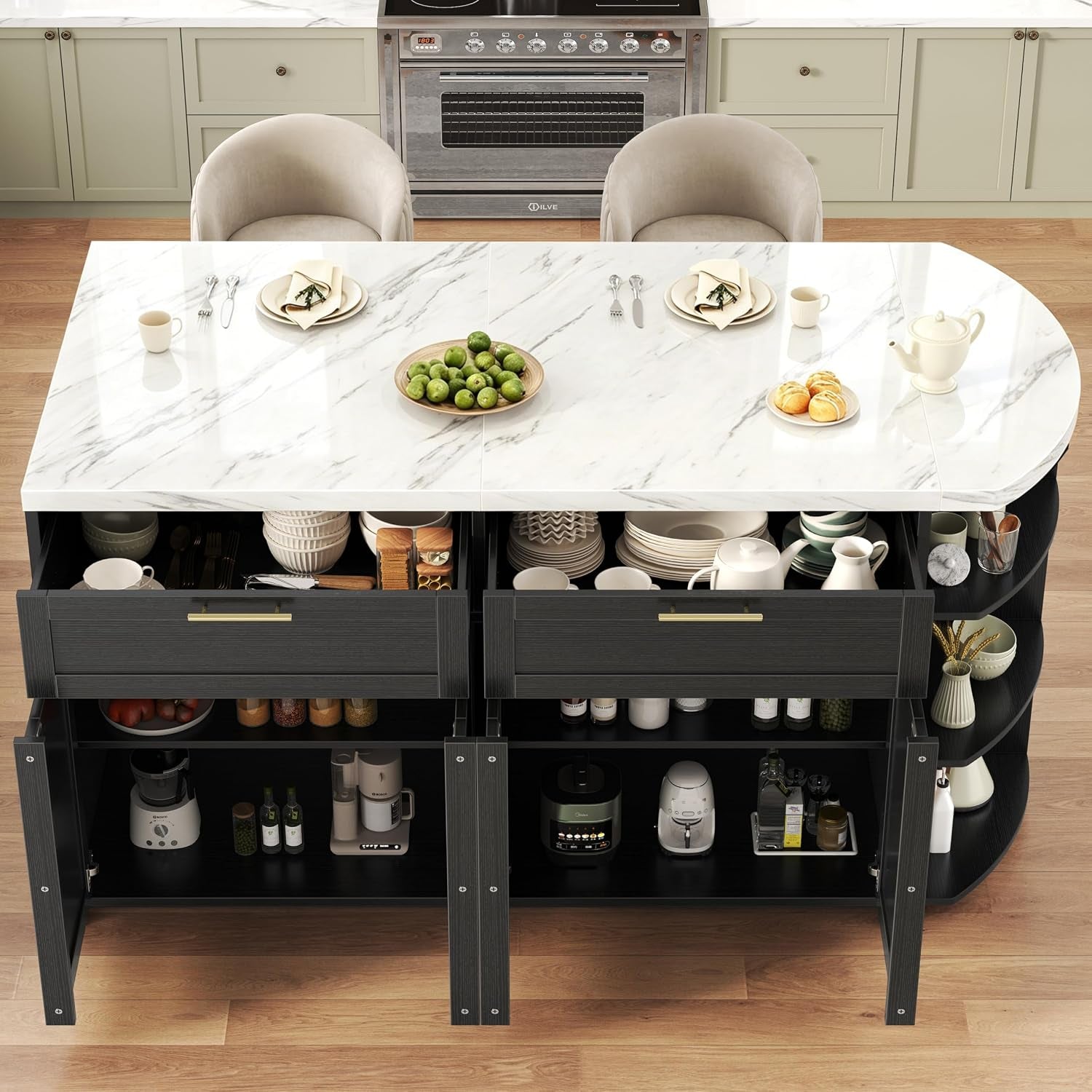 Top-down view of the island with two drawers open revealing organized dishware and lower cabinets with appliances