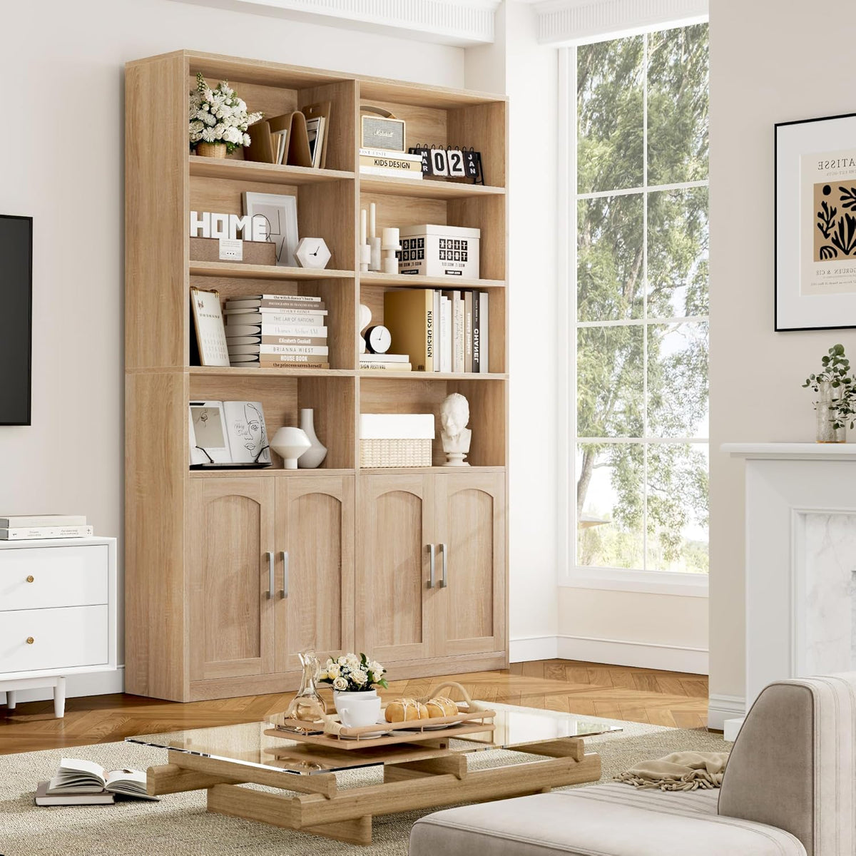 Tall oak-finish bookshelf staged in a living room near a large window, filled with books and decorative objects