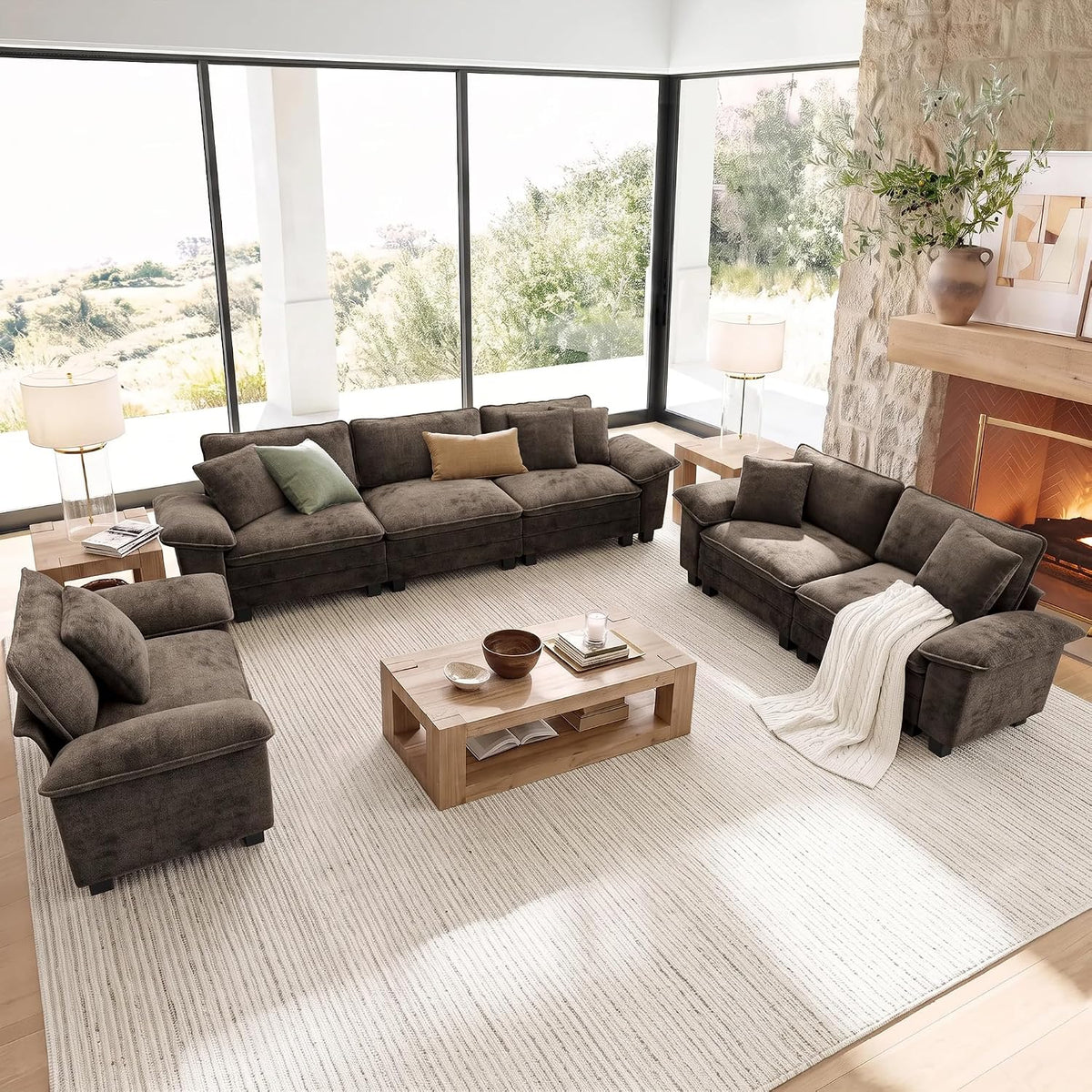 Top-down living room scene showing a dark brown three-seat sofa set with matching loveseat and chair flanking a rectangular