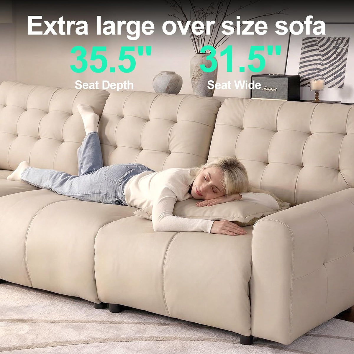 Close-up view of deep seat showing a model lying across the sofa to highlight the 35.5-inch lounge depth