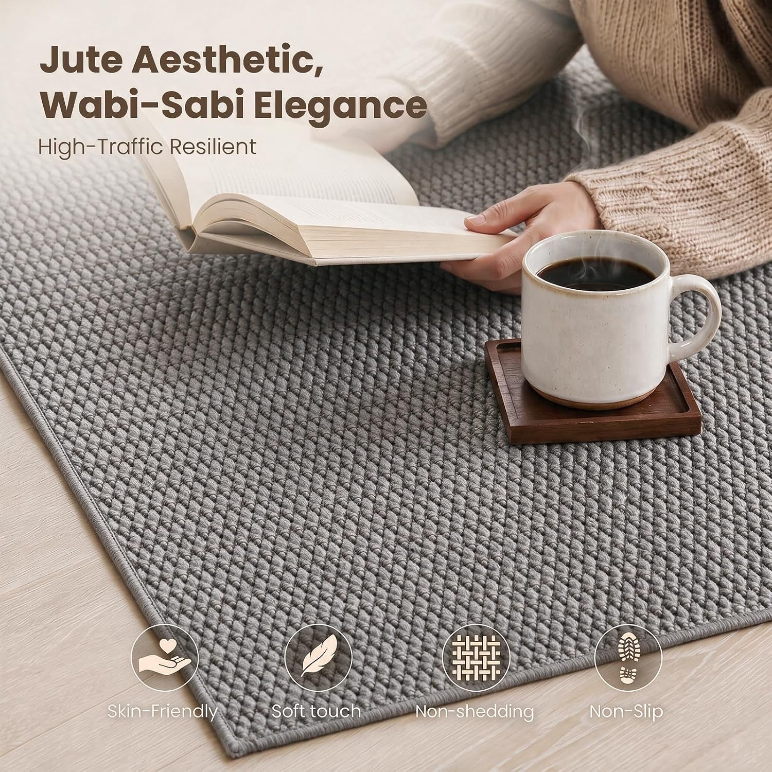 Close-up of grey jute-style woven surface showing low pile texture and tight hazelnut weave with coffee cup