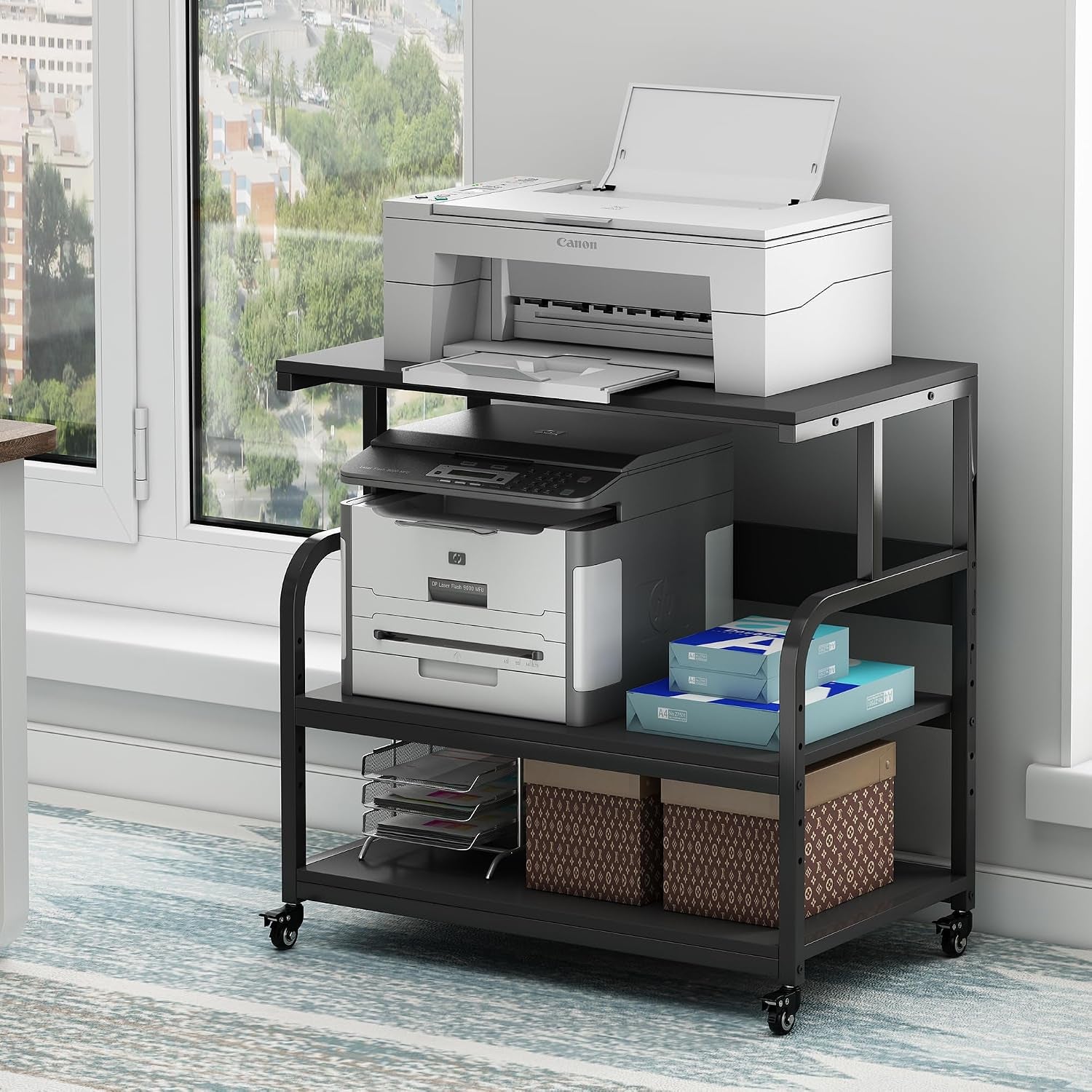 Matte black printer stand on casters with stacked printers and storage boxes on the lower shelf.