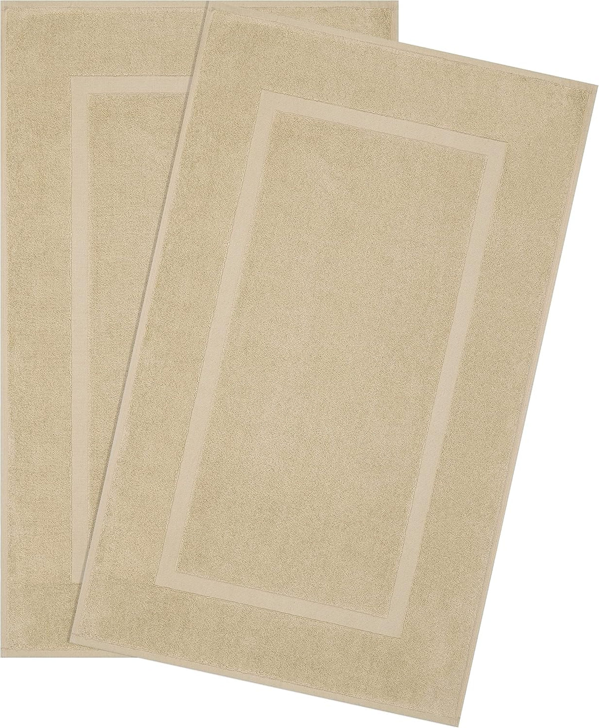 Two overlapping rectangular beige bath mats with a narrow inner border