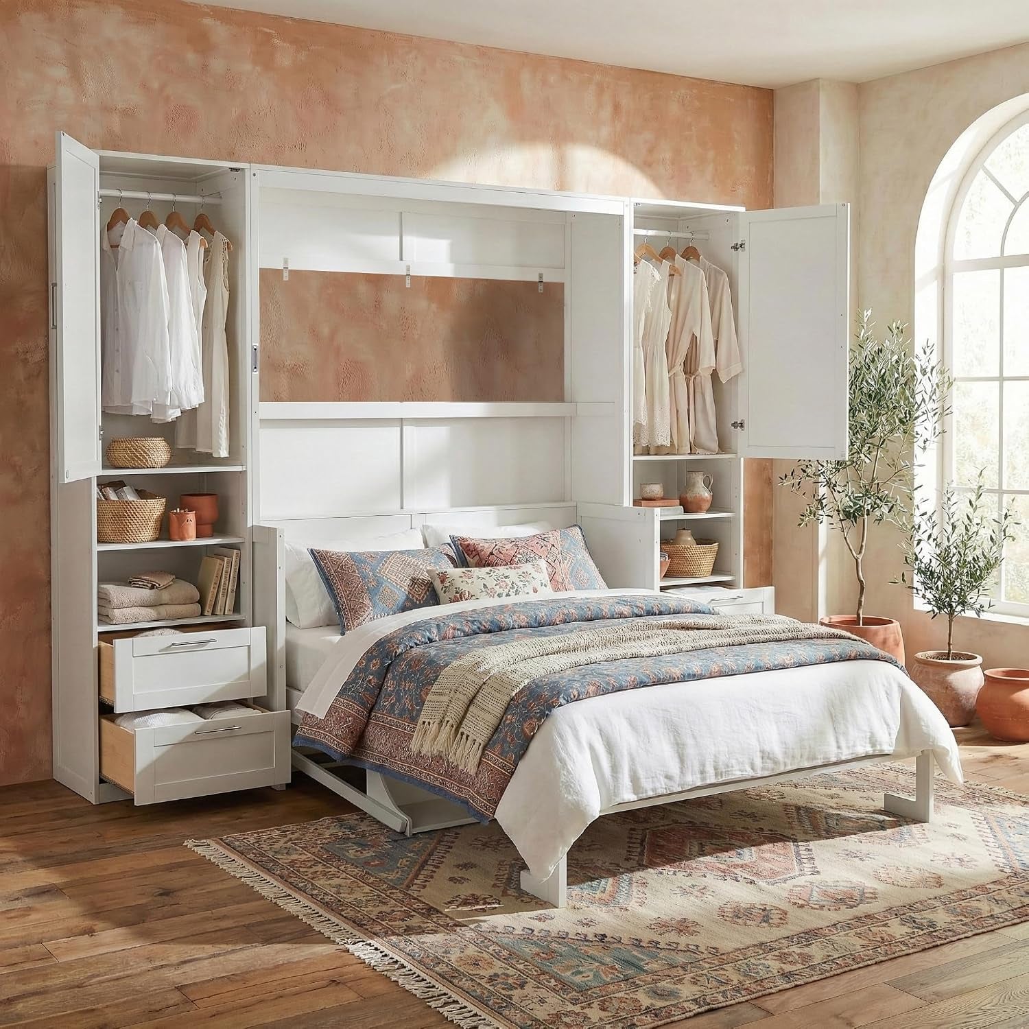 White Murphy wall bed open with styled bedding, wardrobe doors and storage shelves exposed in a warm room