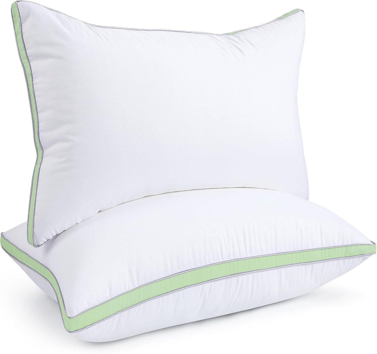 Stacked white pillows shown close with a pale green accent band and slim gray edge piping.