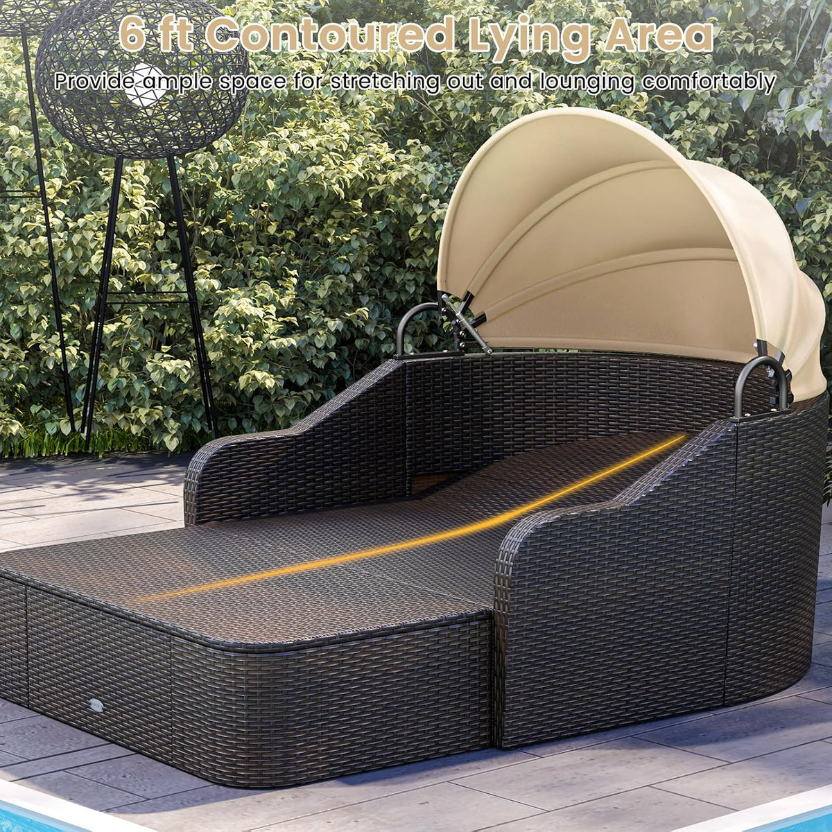 Angled view of contoured rattan daybed with beige canopy open, placed beside a pool