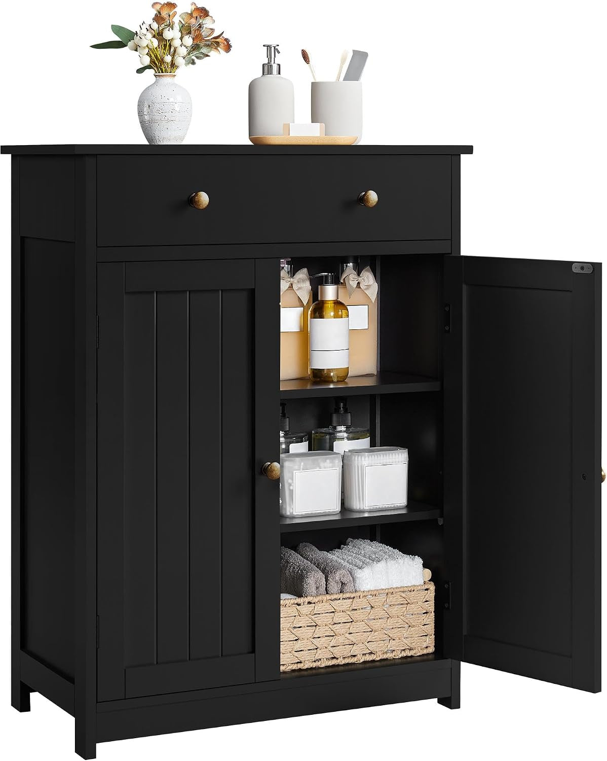 Black cabinet with top drawer, left door closed and right door open showing two interior shelves and stored bottles.