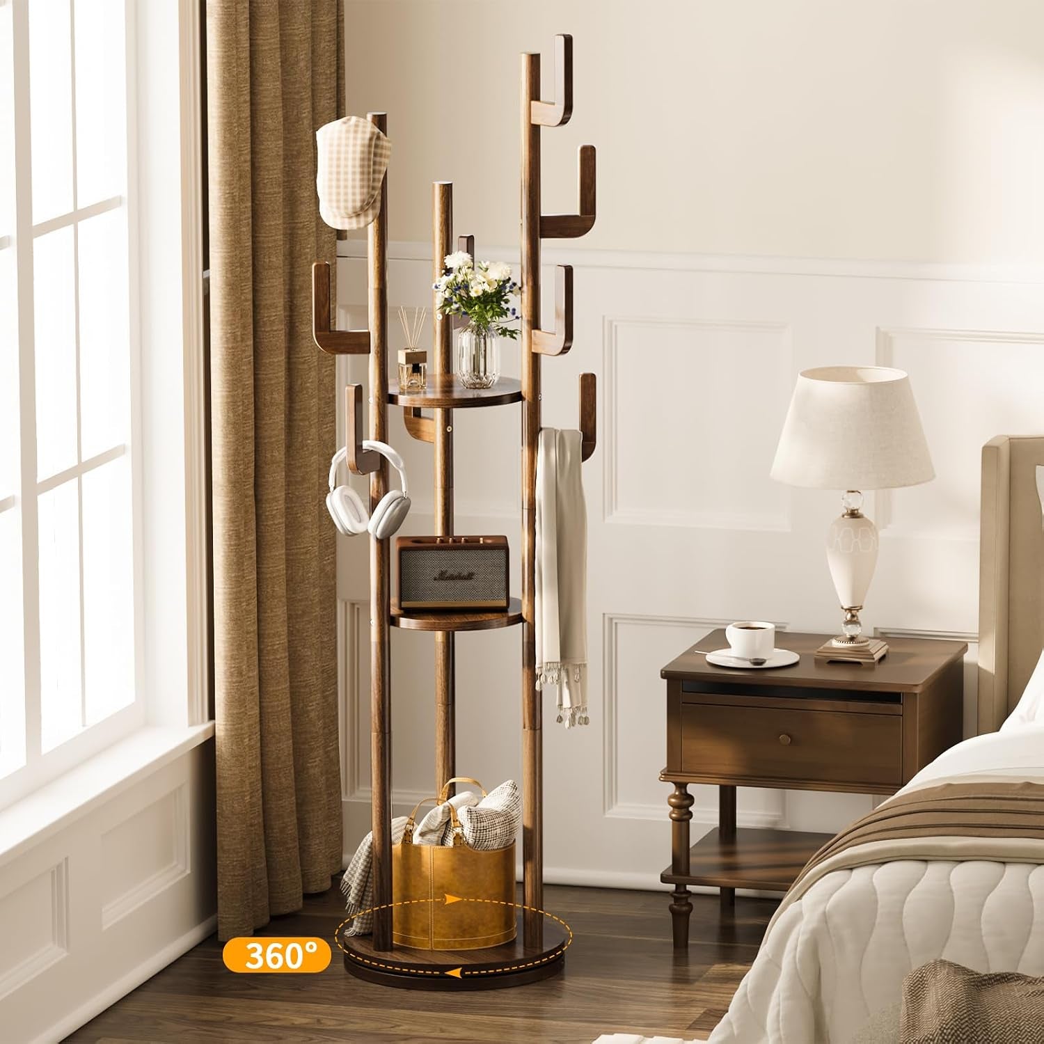 Walnut finish hall tree beside a bed showing three round shelves and hanging accessories