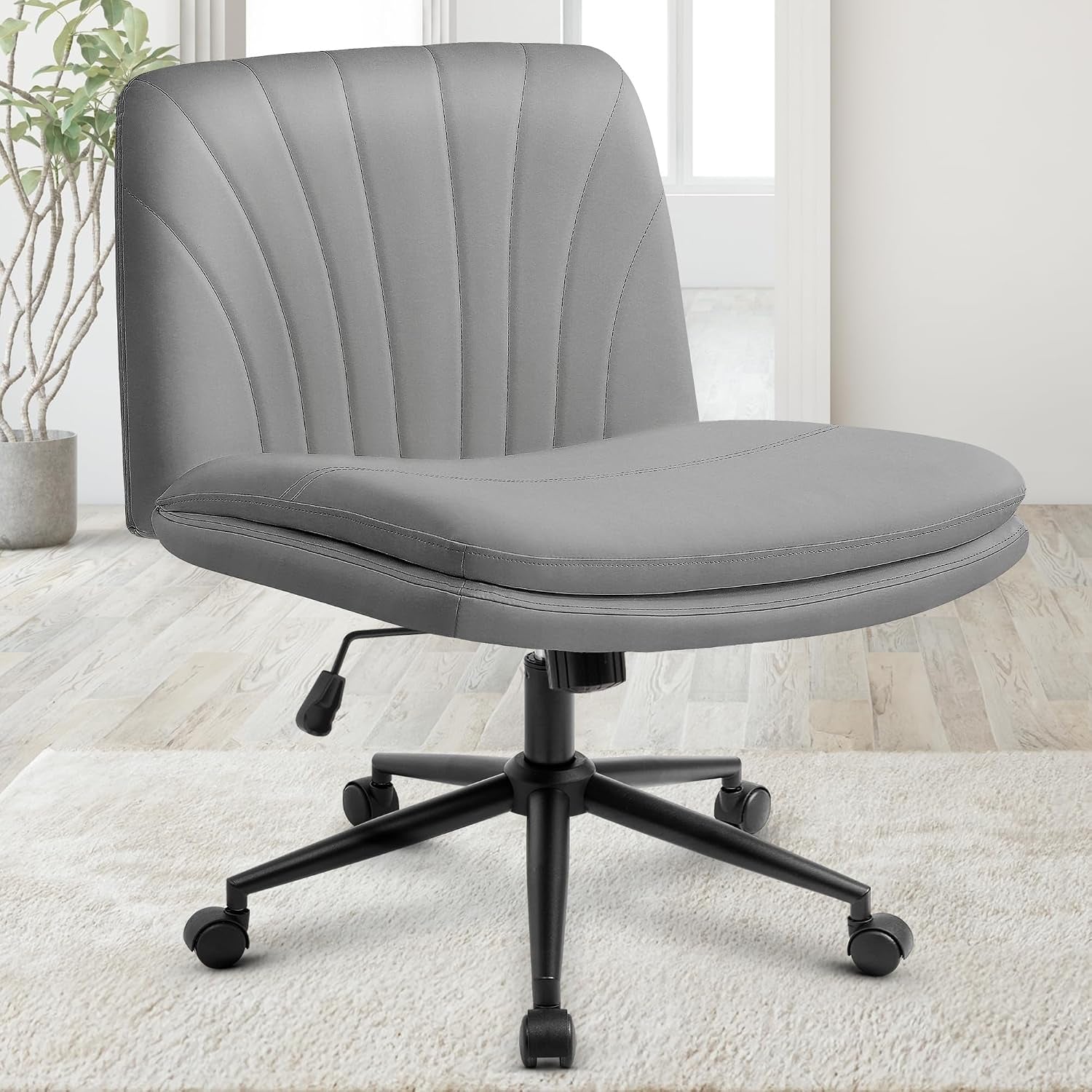 Front three-quarter view of a smooth light-gray swivel desk chair showing padded seat, stitched back, and black five-star