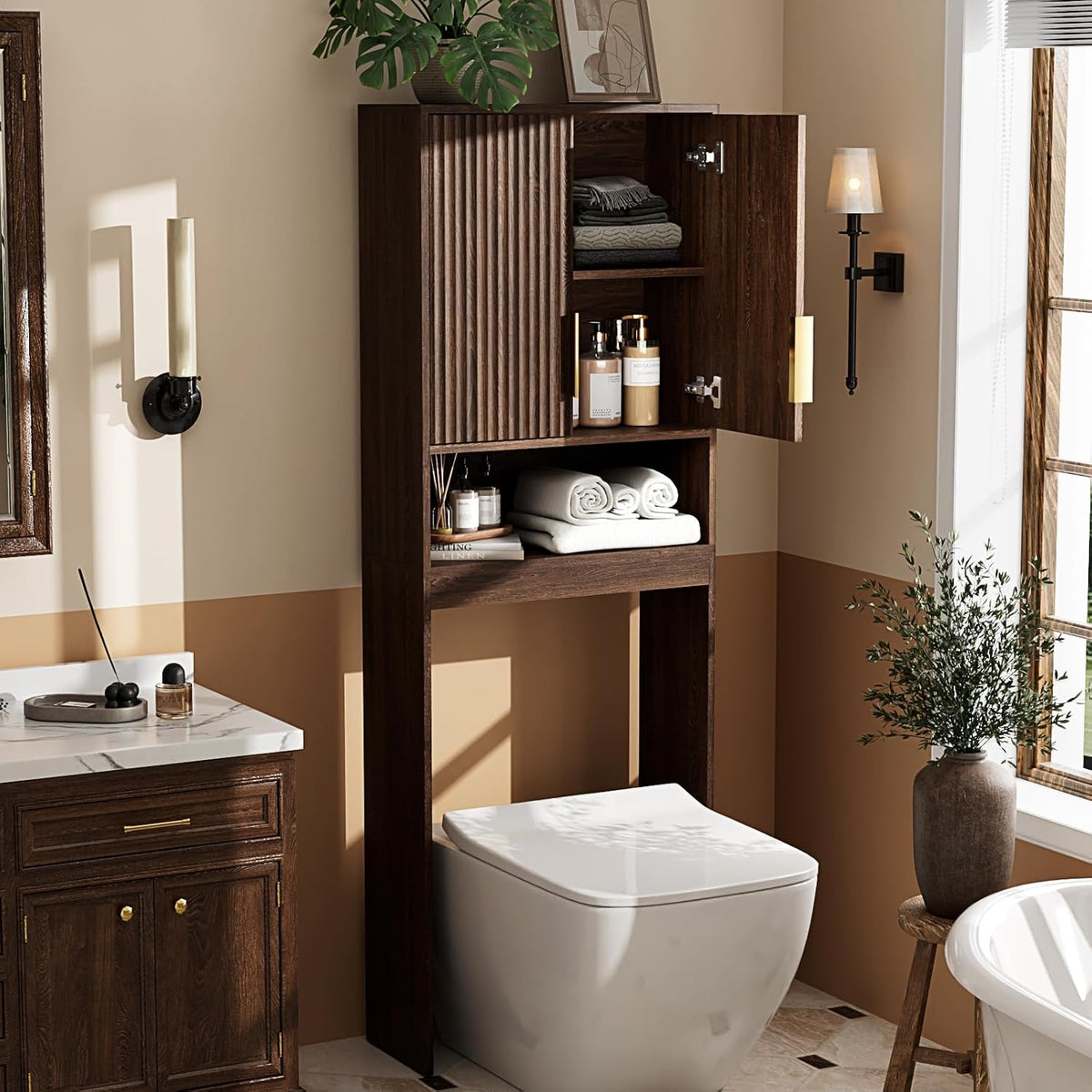 Dark walnut over-toilet cabinet with fluted door open above a white toilet in a styled bathroom