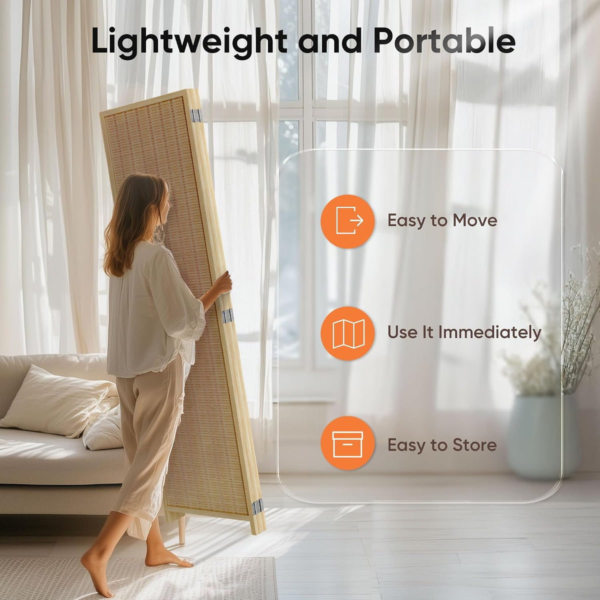 Person lifting a single divider panel to demonstrate the lightweight, portable folding privacy screen