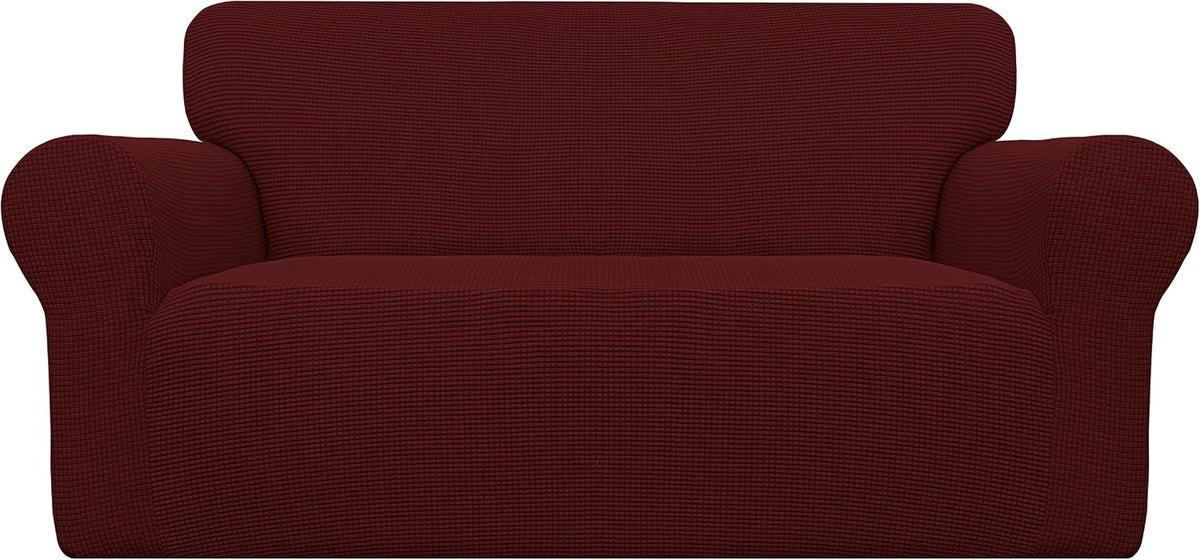Front view of a two-seat loveseat covered in a deep burgundy textured stretch slipcover