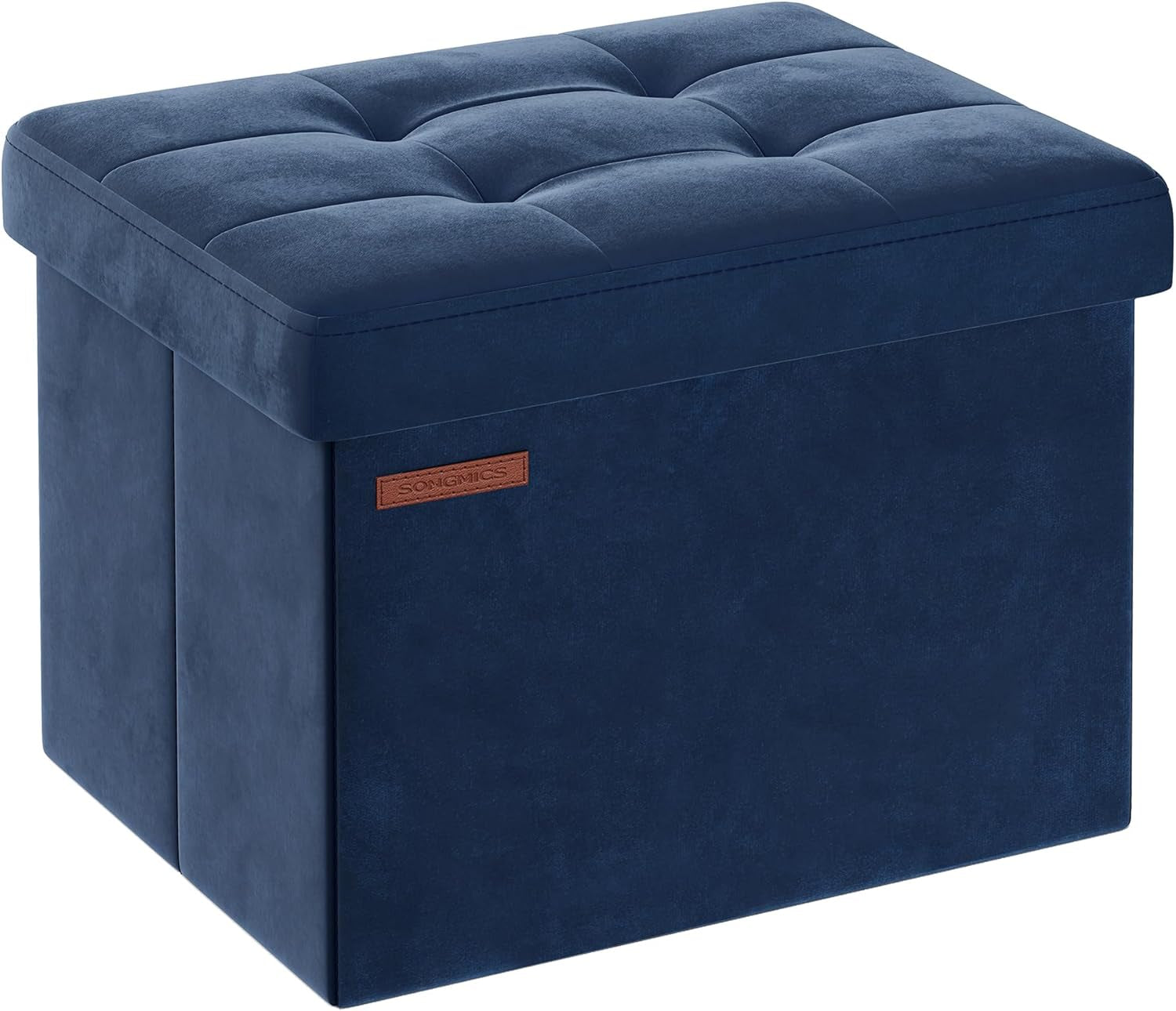Three-quarter view of a navy blue tufted storage ottoman with a padded top and stitched edges.