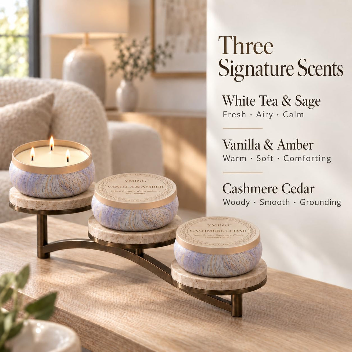 Three marbled tin candles displayed on tiered stone stands with a background panel listing the three scent names