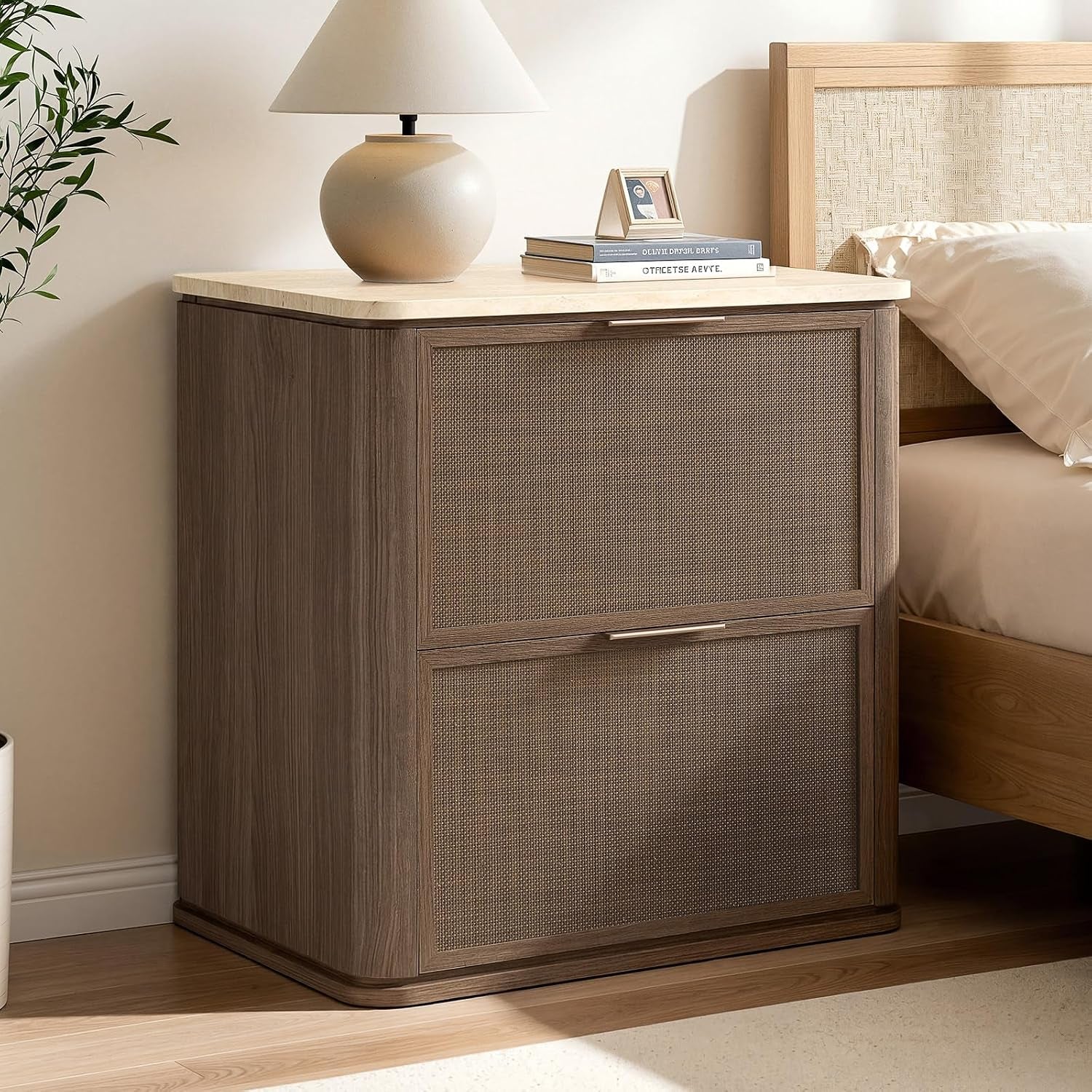 Single dark wood nightstand with faux-marble top next to a bed, styled with a lamp and books.