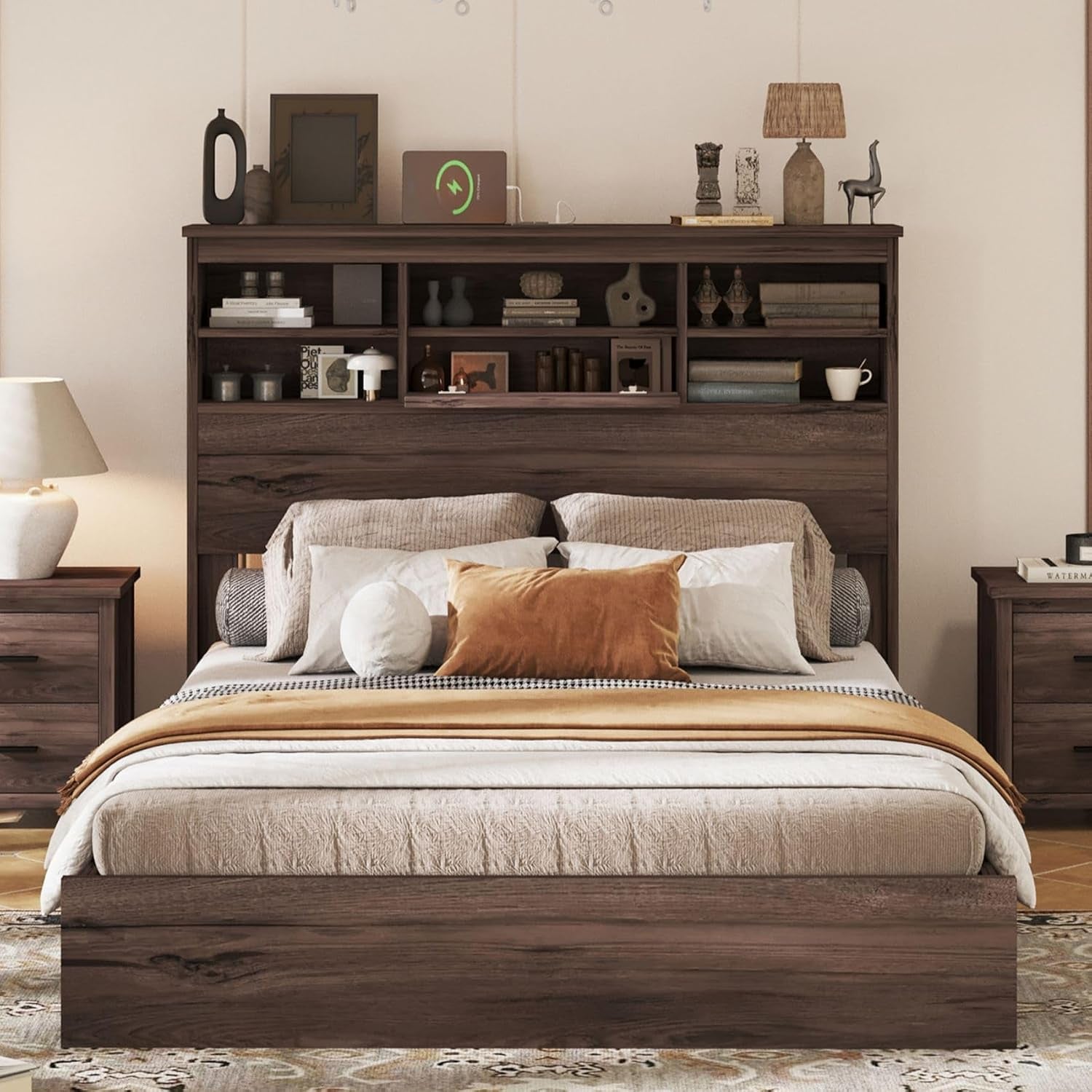Front view of platform bed and headboard showing shelving compartments and mattress in dark walnut finish