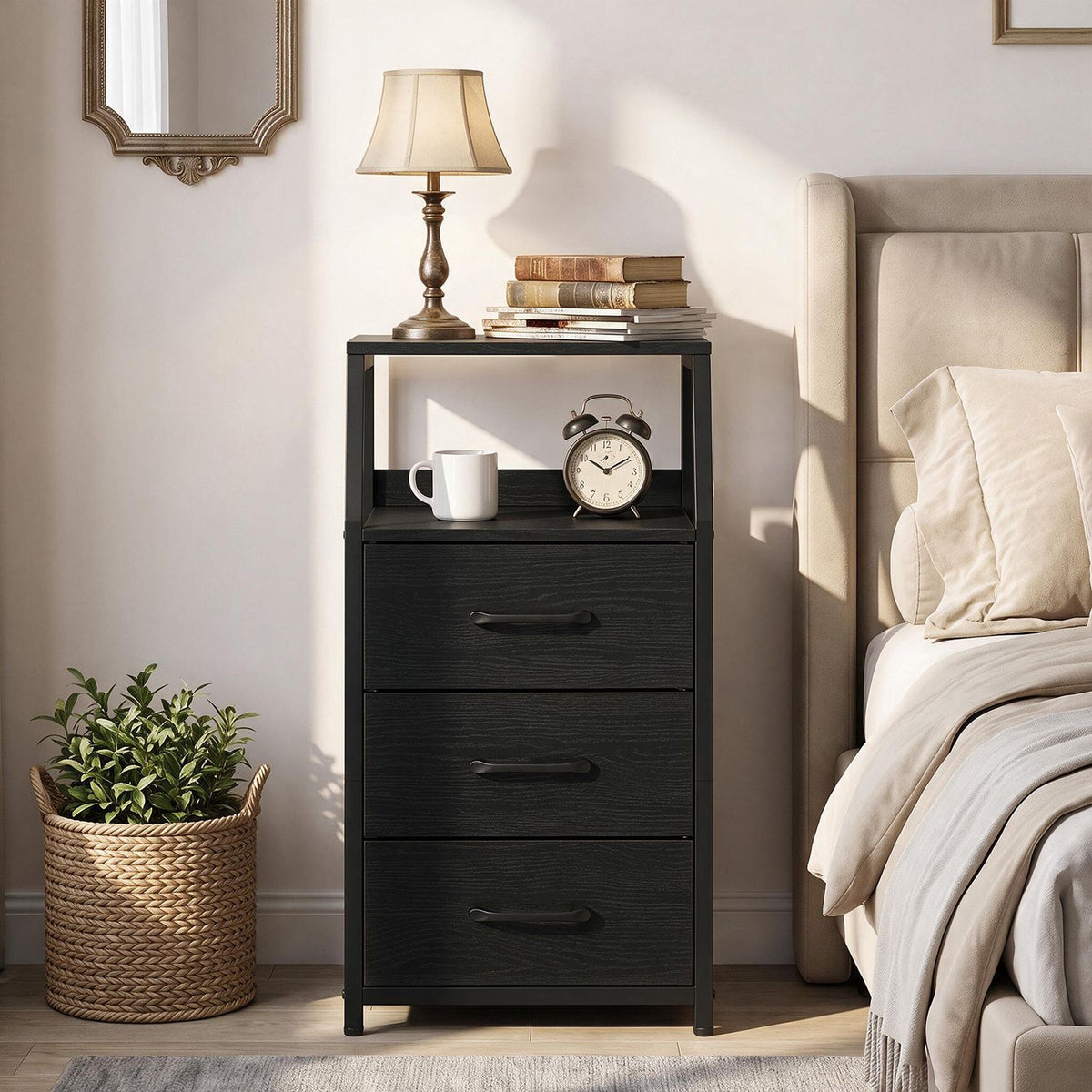 Black nightstand beside a bed, with three drawers, an open shelf, and decor on top.