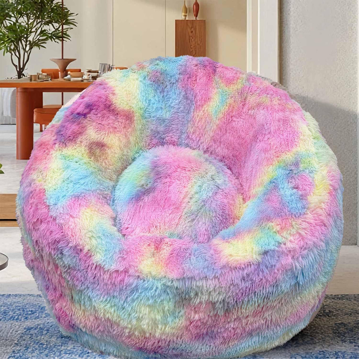 Front view of a fluffy pastel rainbow U-shaped bean bag chair in a living room setting.