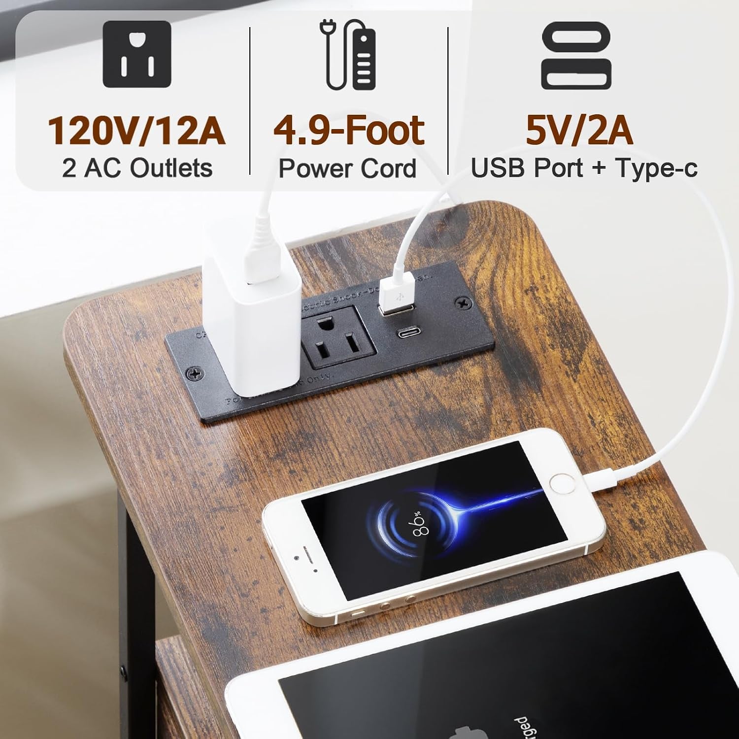 Top view of narrow table's wood top with built-in outlet plate charging two devices
