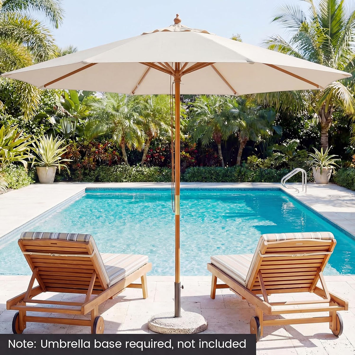 Beige patio umbrella with bamboo-style pole set beside a pool, front view showing vented top
