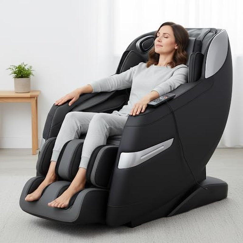 Front three-quarter view of a black massage chair with a relaxed woman reclined, feet in the footrest and remote on the