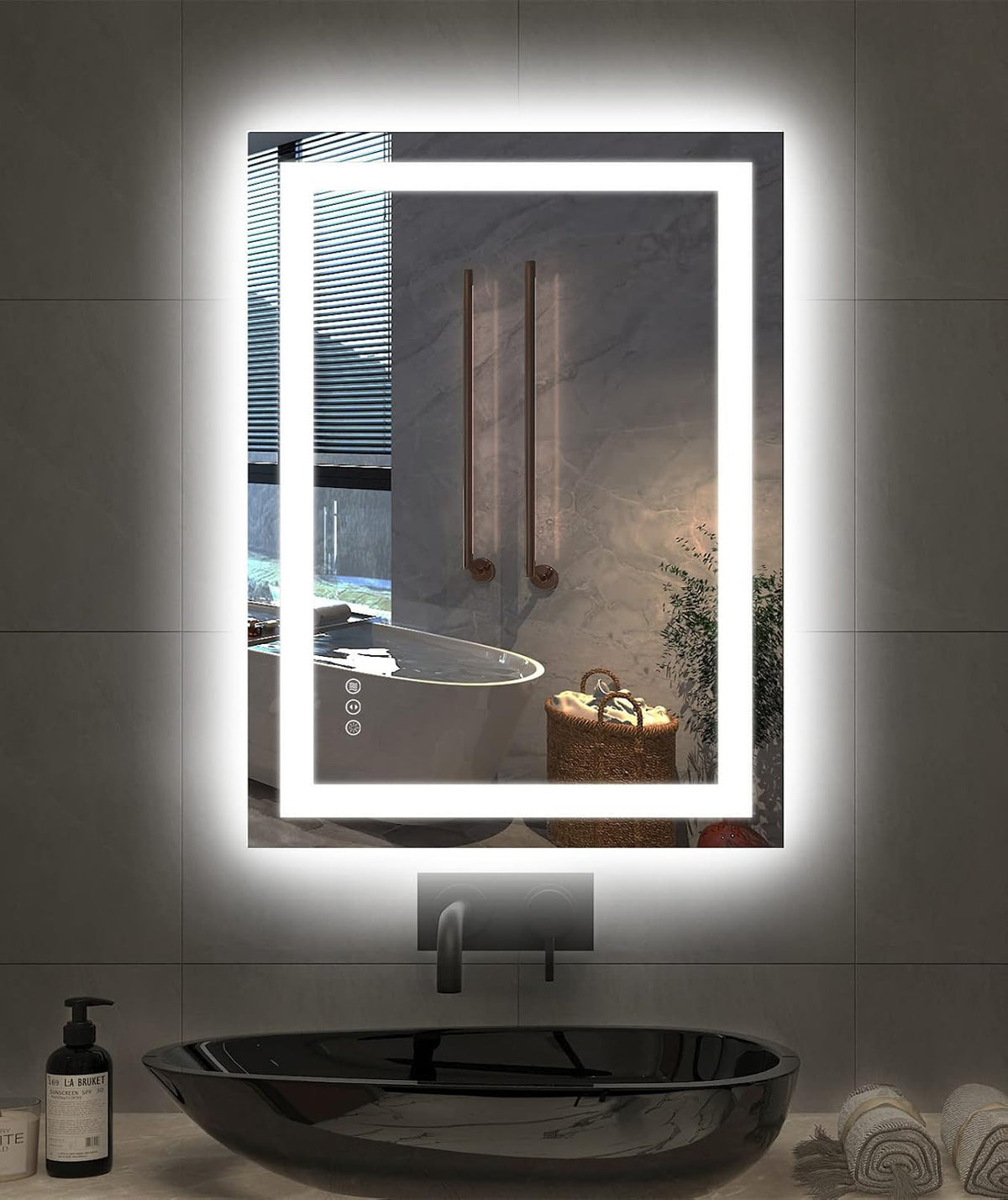 Vertical LED bathroom mirror with bright inner light and halo backlight above a black vessel sink, reflecting a bathtub and