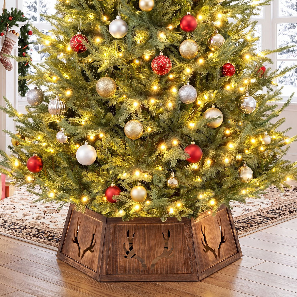 Rustic brown tree collar with antler cutouts beneath a lit, ornamented tree