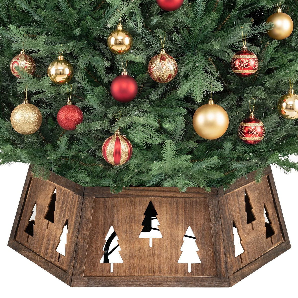 Close view of a decorated tree above a rustic collar, with tree cutouts visible across its panels.