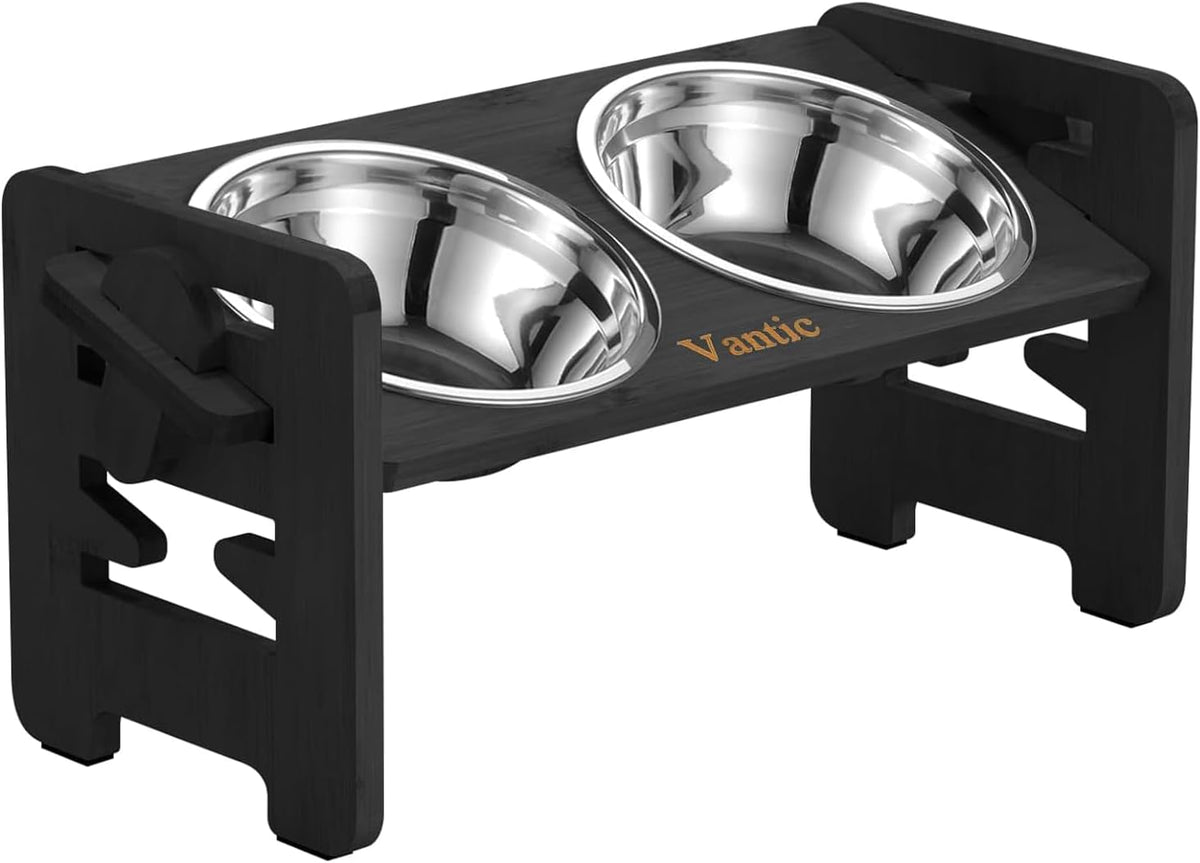 Low angled close-up of the black stand showing two stainless bowls set into the top panel