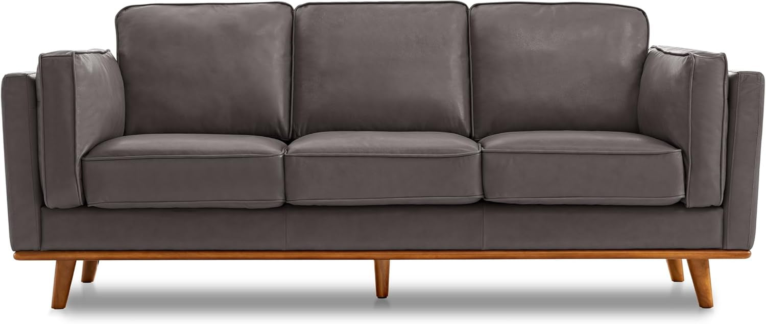 Three-seat grey leather sofa with boxy arms and wooden rail base with tapered legs.