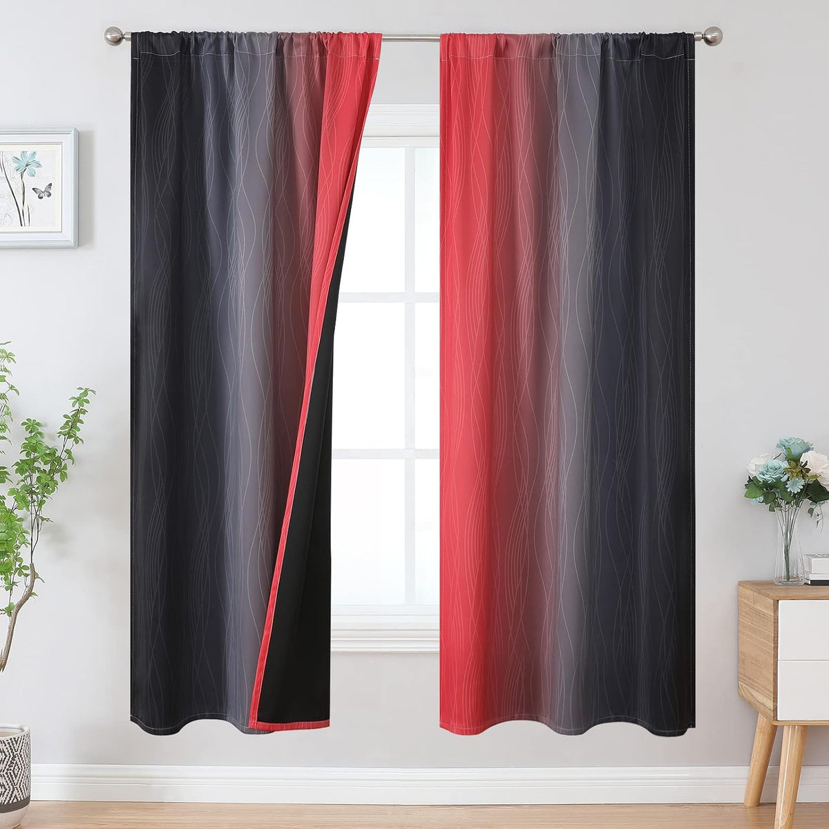Window with two ombre curtains in red to charcoal gradient, one panel opened to reveal black backing