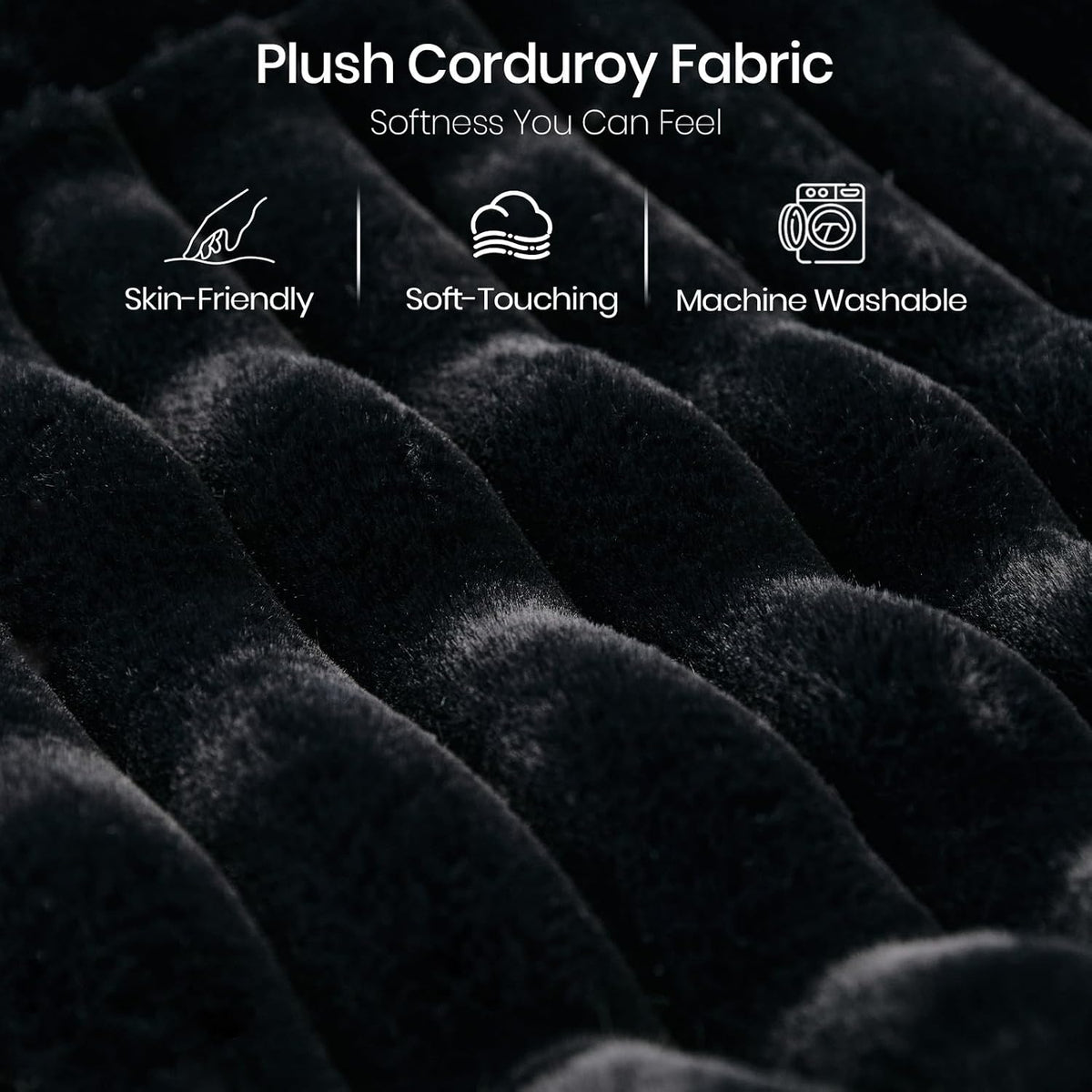 Macro view of plush black corduroy ribs showing soft, tufted texture