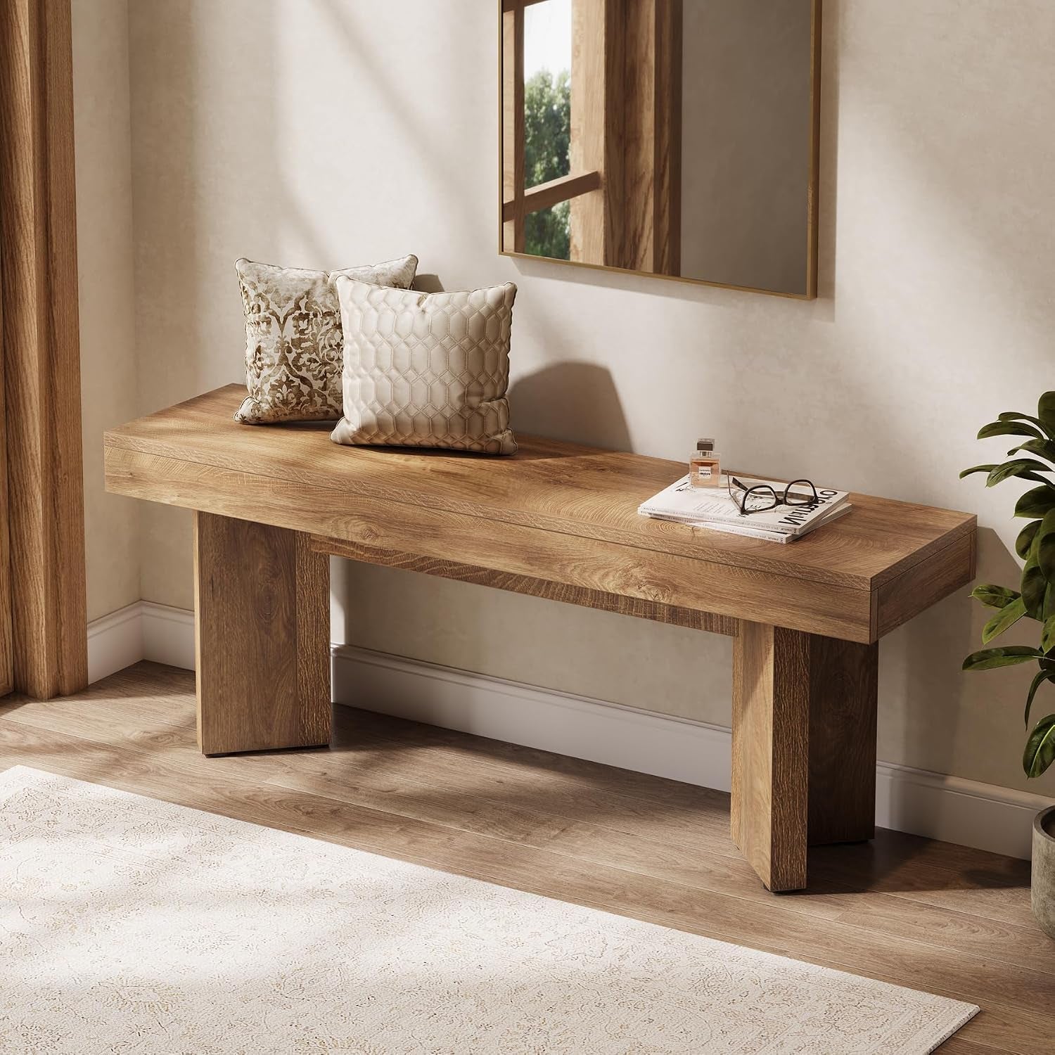 Rustic brown console bench in a hallway setting with two decorative accent pillows on top