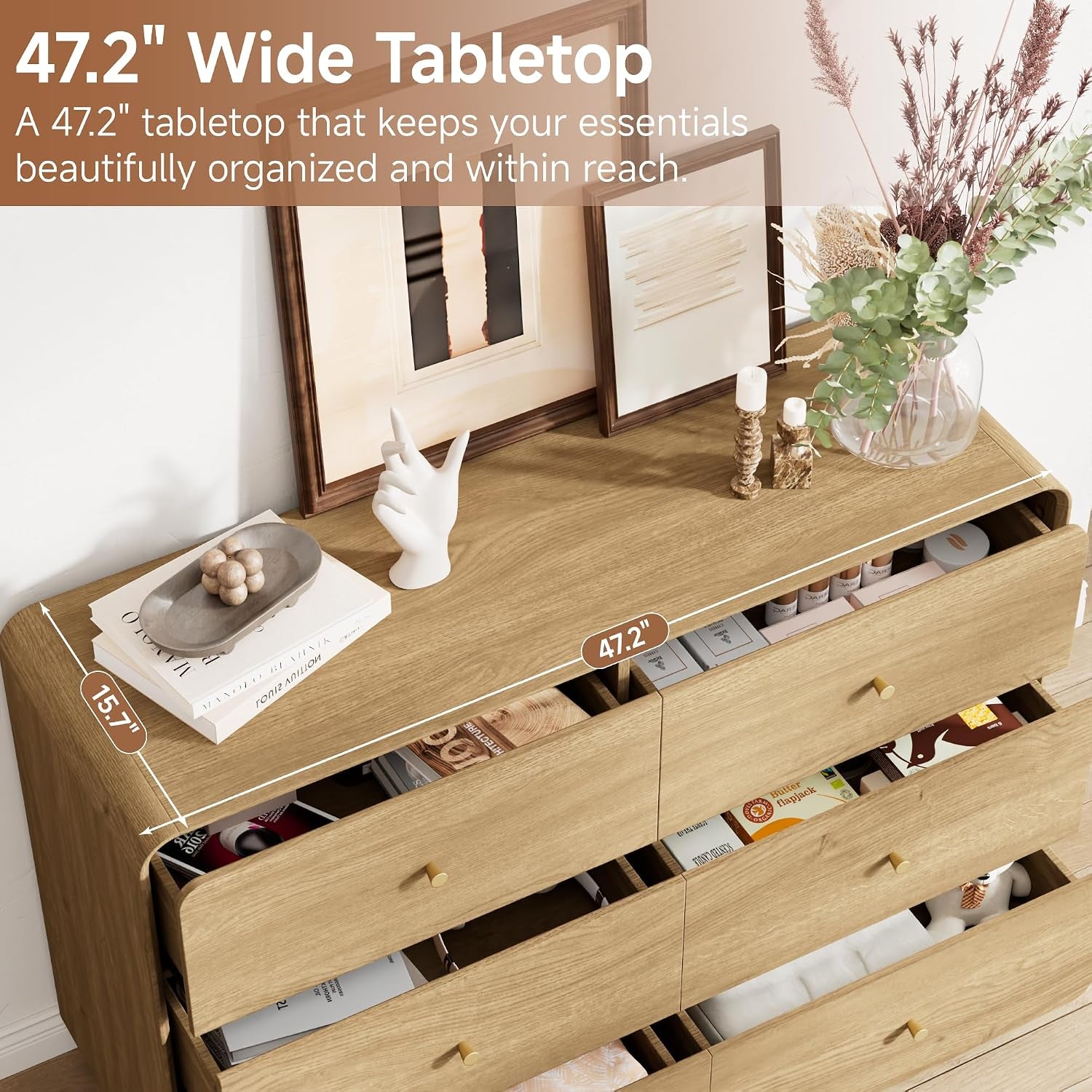 Top-down view of dresser tabletop showing 47.2" width and 15.7" depth with open drawers and staged decor