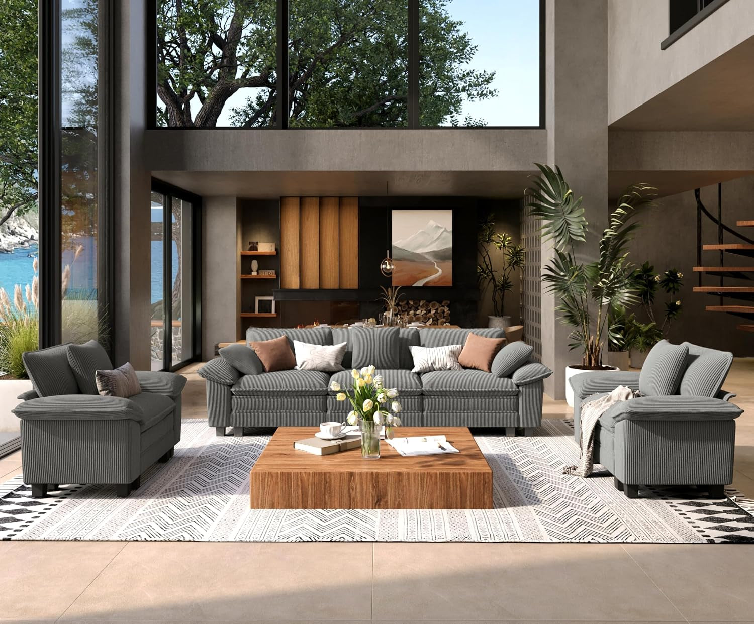 Two-piece sofa set in medium gray with textured fabric, set on a patterned rug before a fireplace wall.