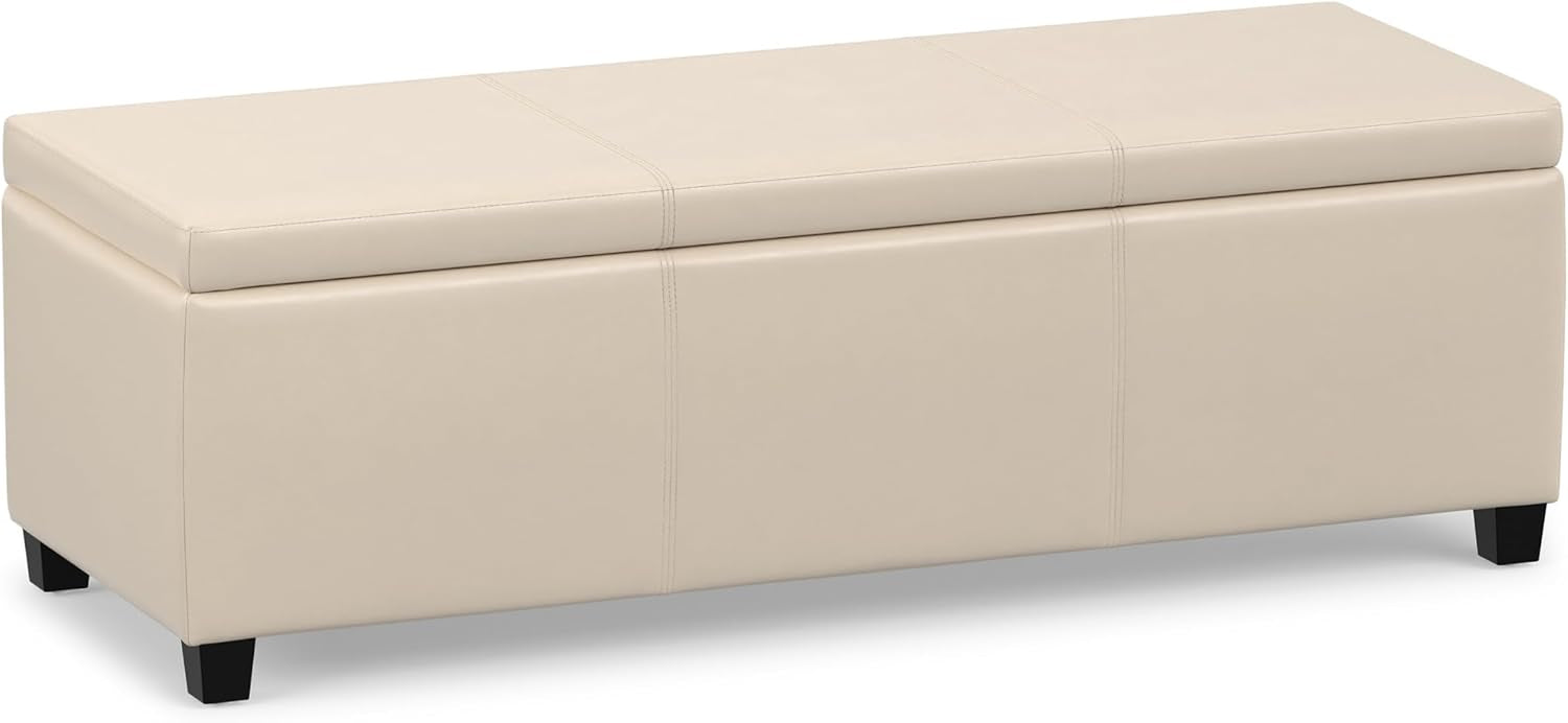 Three-quarter front view of a cream rectangular lift-top storage ottoman on short black legs.